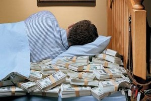lay in a bed with $25,000 cash on it