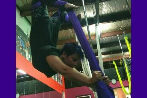 Upside down in aerial hammocks or silks!