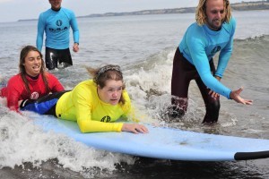 Be able to stand up and learn how to surf in Hawaii