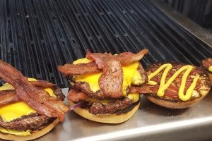 cookin up a storm of burgers