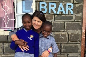 Me with two beautiful children empowered by education